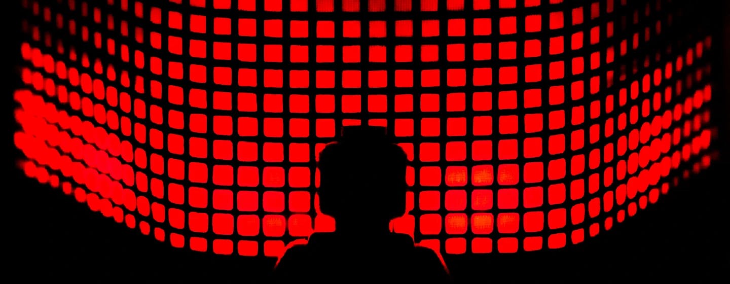 a silhouette of a lego figure in front of a screen featuring red light up squares representing rich fryzel joining as firefish's head of quantitative in the USA